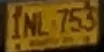 Close-up of the yellow car plate